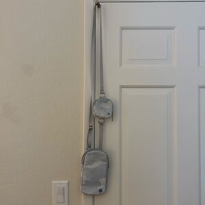 lululemon athletica modular phone crossbody bag with detachable smaller bag.